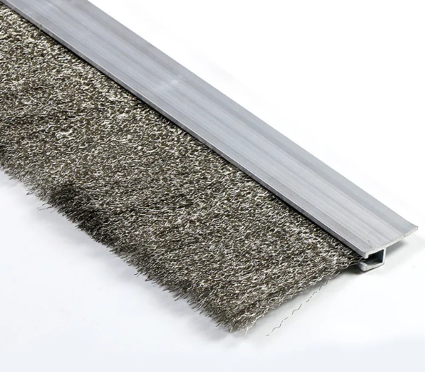 A heavy-duty stainless steel channel strip brush with heat-resistant wire filaments designed for industrial ovens and CNC machine enclosures.